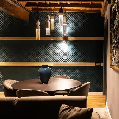 a dining room with a table and chairs at LE RÊVE DE NAIM Roma in Rome