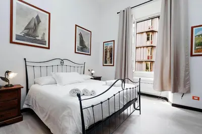 a bedroom with a bed and a window at 4BNB - Cavour Square Apartment in Rome