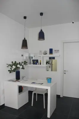 an office with a white desk with a potted plant at Ma Belle Maison in Rome