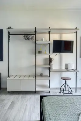 a bedroom with a bunk bed and a desk at Grand Sapienza Apartment by RHR in Rome