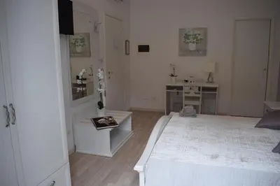 a bathroom with a sink and a mirror at My Bed Vatican Museum in Rome