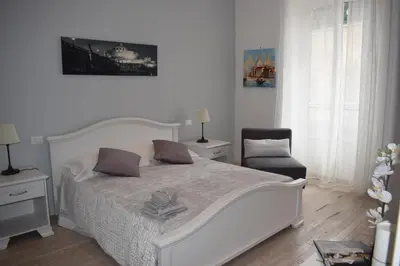 a bedroom with a white bed with pillows on it at My Bed Vatican Museum in Rome