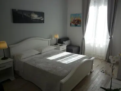 a bedroom with a white bed and a window at My Bed Vatican Museum in Rome