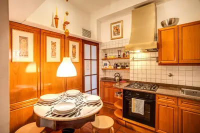 a kitchen with a table with plates on it at Governo Vecchio in Rome