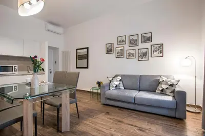 a living room with a couch and a table at Vatican Scipioni 113 in Rome
