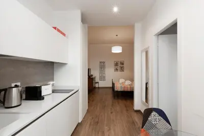 a kitchen with a counter top and a table at Vatican Scipioni 113 in Rome