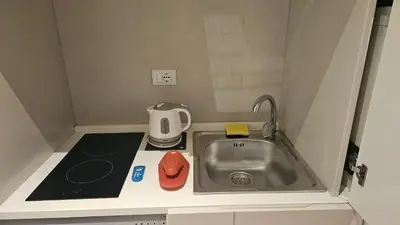 a small kitchen with a sink and a mixer at Ponte della musica Teatro Olimpico in Rome