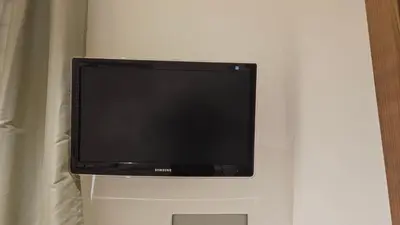 a flat screen tv hanging on a wall at Ponte della musica Teatro Olimpico in Rome