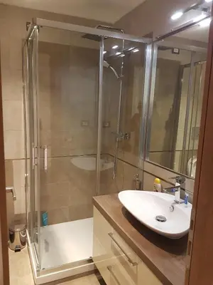 a bathroom with a shower and a white sink at Ponte della musica Teatro Olimpico in Rome
