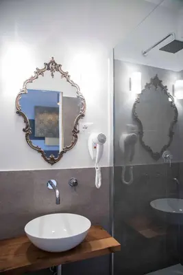 a bathroom with a sink and a mirror at Guest Roma House in Rome
