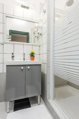 a bathroom with a sink and a shower at A Roma San Pietro Best Bed in Rome