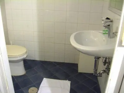 a bathroom with a toilet and a sink at A Roma San Pietro Best Bed in Rome