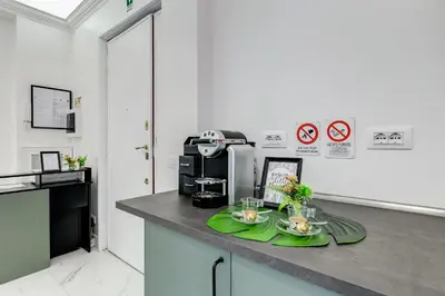 a kitchen with a counter with two plates on it at DIDAVI' Guest House in Rome