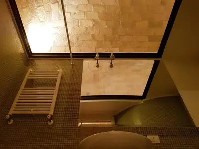 a bathroom with a window and a toilet in a room at The Ancient Wall in Rome