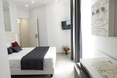 a bedroom with a large bed in a room at Merulana Holidays in Rome