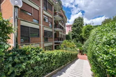 an apartment building with a walkway in front of it at ROMAN DREAM II in Rome