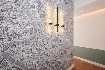 a wall mural of a city with a map at DEM Hotel in Rome