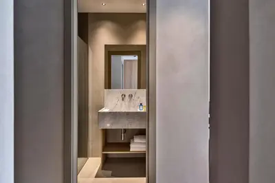 a bathroom with a sink and a mirror at G55 Design Hotel in Rome