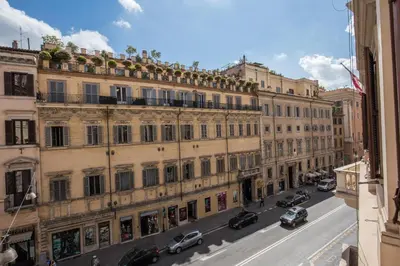 a city street with cars parked in front of buildings at G55 Design Hotel in Rome
