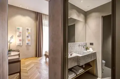 a bathroom with a sink and a mirror at G55 Design Hotel in Rome