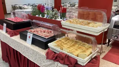 a buffet with different types of bread and other foods at Hotel Casa Tra Noi in Rome