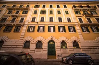 a building with a car parked in front of it at Trastevere Corner Eight in Rome