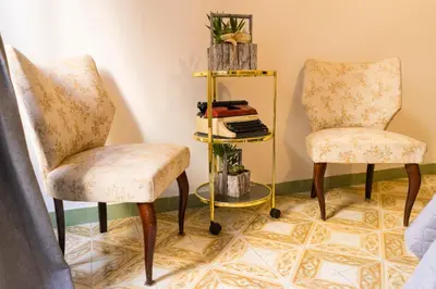 two chairs and a shelf in a room at Trastevere Corner Eight in Rome