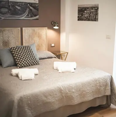 a bedroom with a bed with two pillows on it at Verrazzano 37 Guest House in Rome