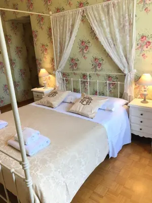 a bedroom with a canopy bed and two night stands at Art Atelier San Pietro in Rome
