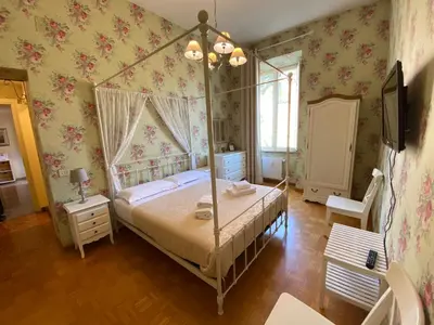 a bedroom with a canopy bed in a room at Art Atelier San Pietro in Rome