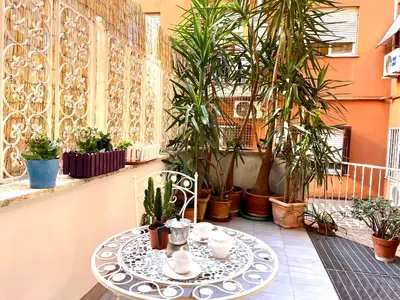 a building with a large glass door on the side of it at Atelier San Pietro in Rome