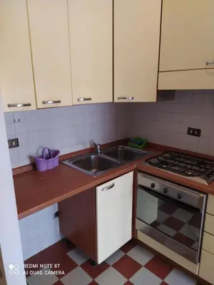 a kitchen with a sink and a stove at Marco's House in Rome