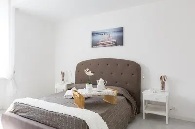 a bedroom with a bed with a table on it at The Imperial Suite in Rome