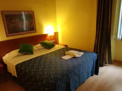 a hotel room with a bed with towels on it at La Casa Dell'Arte in Rome