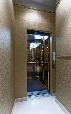 a hallway with a glass door in a building at Antica Dimora De Michaelis in Rome