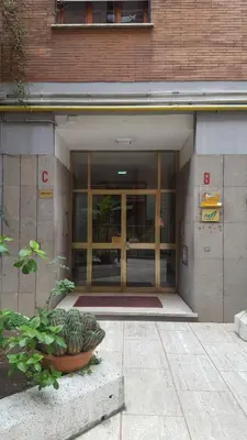 an entrance to a building with a large glass door at Pascià Rooms in Rome