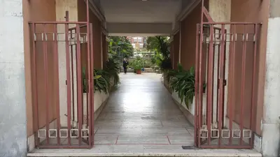 an entrance to a building with red gates at Pascià Rooms in Rome
