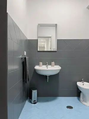 a bathroom with a sink and a toilet at Pascià Rooms in Rome