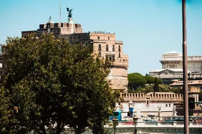 a large building with a statue on top of it at Casa Sangallo in Rome