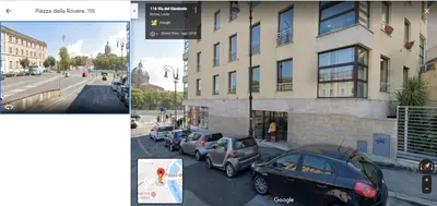 a screenshot of a street with cars parked in front of a building at Casa Sangallo in Rome