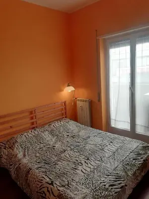 a bedroom with a bed and a window at Casa di Marco a Trastevere in Rome