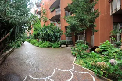 a courtyard of a building with a design on the ground at Casa di Marco a Trastevere in Rome