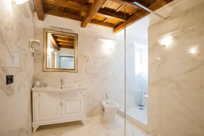 a bathroom with a sink and a toilet and a shower at Royal House in Rome