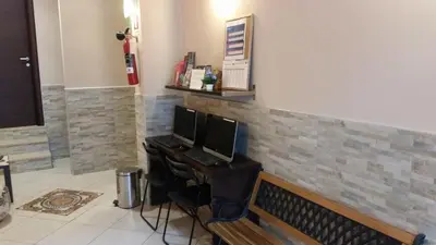 a room with a desk with two computer monitors on it at Hotel Mosaic in Rome