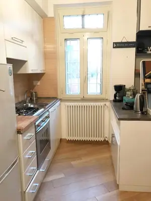 a kitchen with white appliances and a window at Terrace99 in Rome