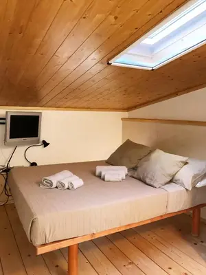 a bed with two towels on it in a room at Terrace99 in Rome