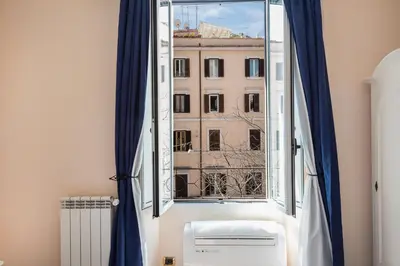 a window with a view of a building at Rome To Stay in Rome
