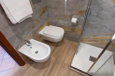a bathroom with a toilet and a sink at Rome To Stay in Rome