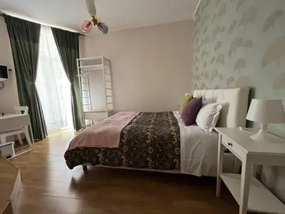 a bedroom with a large bed and a window at Monti49 GuestHouse in Rome