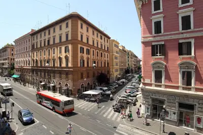 a busy city street with cars and a bus at St. Peter Guest House in Rome